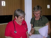 Health Care Access Clinic 10am - Mary Jane Miller, RN (left) and Susan Anderson, ARNP, our new Women's Health provider, discuss a patient's chart.