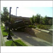 At about 8 a.m. today a pickup truck traveling east on Ninth Street between Kentucky and Vermont streets jumped the curb and ended up on top of a short brick fence