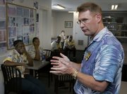 Keith Overton, chief operating officer of Tradewinds Islands Resorts, speaks to some of his employees Tuesday in St. Petersburg Beach, Fla. Overton said the two beachfront resorts he manages on Florida's west coast couldn't stay open without its 100 or so seasonal workers. Tradewinds Islands Resorts now gets most of its foreign workers through an agency that hires them on temporary visas from Jamaica and Thailand. They work as housekeepers, cooks and maintenance engineers.