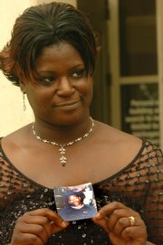 LaTonia Coleman holds a picture Friday of her late husband, Robert Earl Williams, who was shot in front of the Granada in February 2006. District Judge Paula Martin sentenced Rashawn Anderson to 187 months for that murder and the aggravated battery of another man.