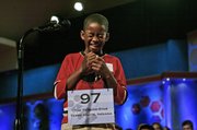 Kennyi Aouad, 11, of Terre Haute, Ind., bursts into laughter when asked to spell the word "sardoodledom" in round three of the 2007 Scripps National Spelling Bee in Washington. After the giggles passed, he spelled the word correctly.