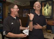 Outgoing Free State athletic director Steve Grant, left, jokes with Firebirds soccer coach Jason Pendleton. Grant's retirement party was Thursday at Louise's West.