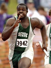 Free State High&squot;s Christian Ballard, the Journal-World&squot;s Male Athlete of the Year, competes in the boys 4x100-meter relay at the Class 6A state track and field meet last month in Wichita. Despite weighing in at 280 pounds, Ballard was an accomplished sprinter during his Free State career. "I got a lot of strange looks," he said. "People were just in awe when they saw me sprint down the track."