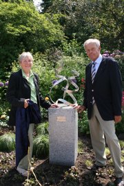Lawrence artist Jan Gaumnitz, left, and Ernst- Joachim Meseck, the deputy mayor of Eutin, Germany, stand next to Gaumnitz's art installation in Eutin. The piece was installed in Eutin this week.