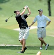 Zechariah Potter tees off on the 17th hole at Alvamar Golf Course. Exhausted golfers frequently push drives to the right, while hitting it left is the right play on this loathsome hole. Potter competed in the Kansas Golf Association Four-Ball Tournament this week.