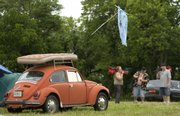 A mattress rests on a small volkswagen as people begin to pack and leave the Wakarusa Music and Camping Festival at Clinton Lake on Sunday.