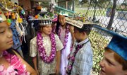 Fifth-graders at Cornerstone at Pedregal School line up for the school&squot;s promotion ceremony with decorated mortar boards in Rancho Palos Verdes, Calif. Some students who decorated their hats with plastic soldiers were made to cut off the weapons due to their school&squot;s "zero tolerance" policy.