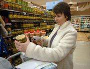 Clare Grasso uses a personal scanner to buy groceries as she shops at Bloom grocery store March 1 in Laurel, Md.