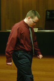 Jason Allen Rose walks out of court Monday morning after receiving a 122-month sentence for the October 2005 fire at Boardwalk Apartments in the 500 block of Fireside Drive. Three people were killed in the fire, and 17 others were injured.