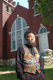 C. Everett Pace will portray Langston Hughes as part of the Baldwin City Chautauqua, which runs today through Sunday at Baker University. Pace stands outside St. Luke's A.M.E. church at Ninth and New York streets in Lawrence, which Hughes attended as a young boy.