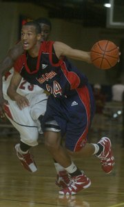 Travis Releford, playing for Kansas City Pump N Run, drives to the basket during an AAU tournament last year in Shawnee. Releford, who will be a senior at Roeland Park Miege this fall, committed to Kansas University on Tuesday.