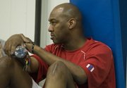 Kansas University assistant basketball coach Danny Manning watches campers scrimmage during the Bill Self team camp for high schoolers. The camp was Friday at Allen Fieldhouse and Horejsi Center.