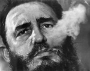 Fidel Castro exhales cigar smoke in this March 1985 file photo during an interview in Havana. Newly declassified CIA papers released Tuesday detail a plot to have American mobsters try to kill the Cuban leader in the early 1960s.
