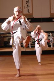 Bill Vermooten, left, and his wife Ginger, Lawrence, are 2007 world champions in Forms after a recent Tae Kwon Do competition.