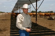 Jose Antonio Elias Calles is a veterinarian and president of HeartBrand Beef, the company that owns the herd of Akaushi breed of cattle in the background. The company has enough animals grazing in south Texas to market purebred American-raised Japanese beef to restaurants and consumers.