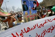 People march during a protest against sectarian violence Friday in a mainly Shiite district of Abu Dshir in southern Baghdad after 17 people died and another 28 were wounded in Thursday's car bombing.