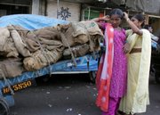 Sex workers stand on a road to attract customers in a red light district in Bombay, India, in 2006. The experts' consensus was that India had the most HIV cases in the world - 5.7 million - and that number could rise if aggressive measures weren't adopted. On Friday, that consensus changed when international AIDS experts and Indian health officials revealed new data showing India to have less than half of that number - 2.5 million people - infected with HIV.