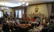 Incoming freshmen circle around for an introduction from Kappa Sigma members during a visit to the fraternity. The cost of greek living is comparable to KU residence hall room and board fees, making it affordable for interested students.