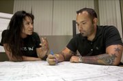 Whole Foods manager Justin Miloro, right, with manager Jheny Molina, is free to show his tattoos at work now that the company has relocated him from Boston to Los Angeles. As tattoos and other types of body art become more popular, employers are striving to devise policies that won't offend customers or eliminate talented workers.