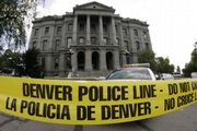 Police tape blocks the path to the Capitol in Denver on Monday after a suspect was shot when he apparently made threats against Gov. Bill Ritter.