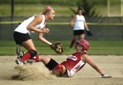 Tonganoxie Braves shortstop Amanda Darrow tags out Fort Scott baserunner Saturday during Tonganoxie's 3-0 loss at the AFA Fastpitch Nationals at Clinton Lake Softball Complex.