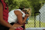 Ashlee Lohman of the Tonganoxie Braves is overcome with frustration Saturday as her team trails Scott Fort 3-0.