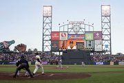 Barry Bonds watches his 754th career home run sail past the stadium lights in the first inning of San Francisco's game against Florida Friday night.