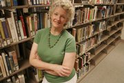 Mimi Thebo, who lived in Lawrence for about 10 years, is back in the United States to promote "Welcome to Eudora," her latest novel. She is pictured at the Lawrence Public Library, 707 Vt.