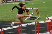 Alexa Harmon-Thomas, 11, runs the 80-meter hurdles at the AAU Junior Olympics last week in Knoxville, Tenn. Harmon-Thomas broke the national record in her age group in the event.