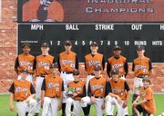 The 14U Kansas outlaws took home the state title at the USSSA state tournament in Olathe. Pictured above, members of the team pose with a trophy after a tournament victory.