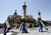 Workers roll up carpets used by thousands of pilgrims Friday at the holy shrine of Imam Moussa al-Kadhim in the Kazimiyah neighborhood of Baghdad. Shiite pilgrims made their annual march Thursday to commemorate the eighth-century death of Imam Moussa al-Kadhim, a key Shiite saint.