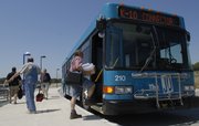 Riders board and exit the K-10 Connector bus in the Kansas University-Lawrence Park & Ride lot near Clinton Parkway and Crestline Drive. The K-10 bus offers daily, round-trip rides to Johnson County Community College and KU's Edwards Campus.