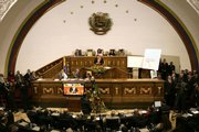 Venezuela's National Assembly listens as President Hugo Chavez delivers a speech Wednesday at the National Assembly in Caracas. He presented his blueprint for constitutional changes expected to allow him to be re-elected indefinitely, a move his critics call a threat to democracy.