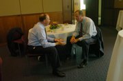 State Rep. Kenny Wilk, left, and Sen. Nick Jordan visit after Wilk received the National Bioscience Industry Organization Legislator of the Year Award. The award was presented July 11, 2005, at the Dole Institute of Politics.