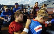 Kansas quarterback Todd Reesing autographs the jersey of 9-year-old Drew Lawrence, Overland Park, during fan appreciation day Wednesday at Memorial Stadium.