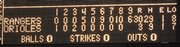 The center-field scoreboard tells the story of Game One of a baseball doubleheader between the Rangers and Orioles. Texas won, 30-3, Wednesday in Baltimore, becoming the first team in 110 years to score 30 runs in a game.