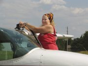 In this undated photo provided by AirCapital DropZone.com, pilot Lori Love is shown refueling a plane. Love, a Wichita native, was last heard from an hour after taking off from Accra, Ghana, on
Aug. 17.