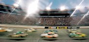 Cars race through a turn on the new surface at Bristol Motor Speedway during the Busch Series Food City 250. Kasey Kahne won the race Friday in Bristol, Tenn.