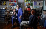 Bonita Yoder, a local attorney and real estate agent, is scaling back her other lines of work, in part, to do more motivational speaking that involves her ventriloquism act. Yoder is pictured on Monday at her home.