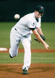 Minnesota's Scott Baker delivers against Kansas City. Baker took a perfect game into the ninth inning and settled for a one-hitter in the Twins' 5-0 victory Friday night in Minneapolis.