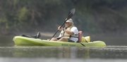 Chip Farley cruises into Lawrence after a trip on the Kansas River for the past two days. Farley and two other volunteers spent time on the Kaw inspecting the waterway from Topeka to Lawrence.