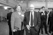 Linda Zarda Cook, an executive director of Royal Dutch Shell, visits with Kansas University Chancellor Robert Hemenway during the KU School of Engineering Distinguished Engineering Service Award banquet in May. Cook, a 1980 petroleum engineering alumna who appears on Forbes' 100 most powerful women list, received the school's award for 2007.