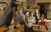 From left, Lee Henry, Kelly Barth and Nora Kaschube are buying The Raven Bookstore, 8 E. Seventh Street. The new shopowners say they are ready for the challenge of operating an independent bookstore in a market filled with Internet competition and major chain retailers.