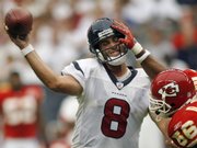 Houston quarterback Matt Schaub (8) throws an incomplete pass as Kansas City linebacker Derrick Johnson (56) hits him during the second quarter. The Texans won, 20-3, Sunday in Houston.