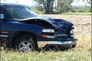 The front end and windshield of a 2002 Chevrolet Pickup truck show damage after a hit and run that killed two highway workers south of Lawrence.