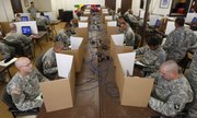 Soldiers of the 101st Airborne take a cognitive skills test in preparation for deployment to Iraq in Fort Campbell, Ky. The tests are part of an Army program that records how soldiers' brains work when healthy.
