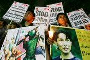 Protesters from Myanmar's National League for Democracy holding a picture of Myanmar opposition leader Aung San Suu Kyi stage a candlelight rally Saturday against Myanmar's military junta in downtown Seoul, South Korea. South Korea expressed grave concern Thursday over Myanmar's crackdown on massive protests and called on the government there to exercise restraint.