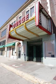 The Dodge Theater is chained shut Monday in Dodge City. Despite efforts to revitalize the theater, it stands remodeled, but vacant, after the owners spent $200,000 renovating the building, which was built and opened in 1929. The world premiere of the 1939 movie "Dodge City" took place at the Dodge Theater.