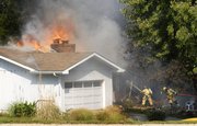Flames engulf a home at 1779 E. 1338 Road around 11 a.m. Monday. The Wakarusa Township Fire Department responded first to the blaze, and was aided by several other township units. Nobody was home at the time of the fire.