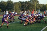 The Baldwin High football team lines up in the single wing offensive formation during a recent game. Zach Dur (7) is the wing back, Drew Berg, center, is the blocking back and Sam Beecher and Jared Hall are the tailback and fullback. Baldwin is averaging seven yards per carry this fall.